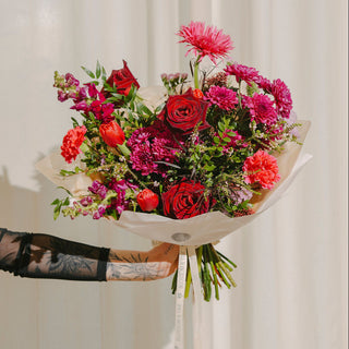 Bouquet of flowers with red and pink colors on a white background